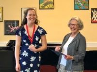 Alice Hauser receives the Frank Glazer Award from the Conservatory's co-founder, Carol Elowe. 