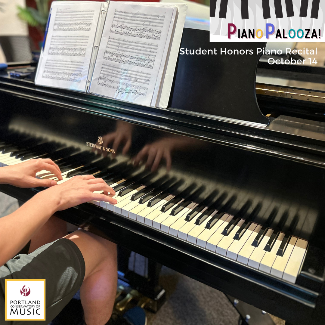 Someone sitting at a piano ready to play